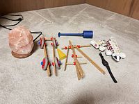 Group shot showing salt lamp, Brio builder pieces, blue mallet, Cardinal watch and toy train cars