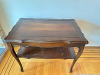 Full view showing tabletop, lower shelf, legs