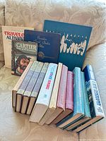 Group of 14 vintage books including Reader’s Digest Condensed Books, Canadian geography titles, biography and travel paperback