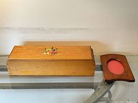 Front view of wooden box and picture frame