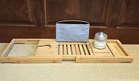 Bathtub tray fully extended with jar positioned on right side