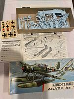 Box lid art, sprues, instructions, decals and paperwork inside box