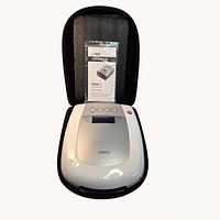 Massager in open case with manual