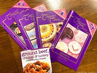 Four purple Series 2 hole-punched booklets and Ground Beef, Chicken & Turkey book