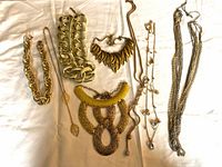 Group view of all seven gold-tone jewelry pieces