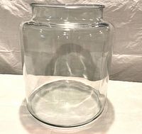 front view of clear glass jar showing shape and size