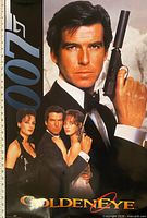 Front view of GoldenEye 007 theatrical poster showing full artwork and measuring tape for scale