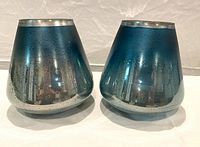 pair of blue glass votive holders front view