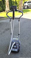 Full view of Rowenta IS9100 garment steamer with handle, poles, hose and base