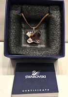 Pendant necklace in original box with certificate booklet visible