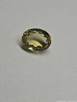 Top view of oval lemon citrine on neutral background
