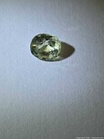 Front view of cushion-cut mint-green garnet
