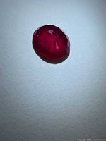 Top view of oval blood-red ruby