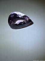 Pear-cut amethyst angled view highlighting facets and color