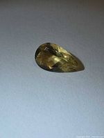 Pear-cut golden yellow heliodor gemstone side view