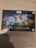 Front of sealed Bandai Star Wars X-Wing Starfighter RED5 model kit box