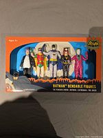 Front of boxed set showing five figures and Batman branding
