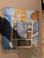 Sealed blanket package with product insert visible