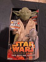 Front view of boxed Yoda talking figure