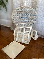 Front view showing full birdcage with tray removed