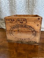 Front view showing Canadian Butter Ontario branding and dovetail joints
