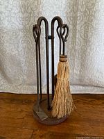 full view of fireplace tool set on stand