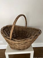 Side view showing full basket and handle