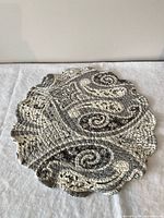 Grey/white paisley side of reversible quilted placemat
