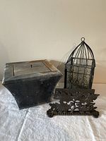 All three items grouped: fire pot, boot scraper, birdcage hurricane