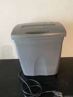 Full view of Fellowes paper shredder front and power cord