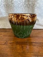 Front view showing glaze colors and raised pattern