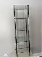 Full front view of chrome and glass shelf showing five levels