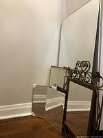 all four mirrors leaning against wall showing sizes and frames