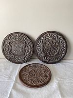 Front view showing all three carved medallions