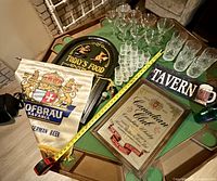Overall lot showing banner, mirror, signs and all glassware