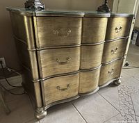 Front view of Ethan Allen bombe dresser with lamps and glass top