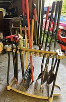 Overall view of Suncast rack holding multiple garden tools