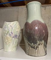 Both vases side by side on shelf