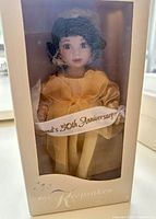 Front view of boxed Marie Osmond porcelain doll