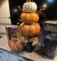stacked pumpkin topiary, wicker pumpkin, boxed witch shown together