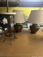All three lamps grouped on table showing overall form