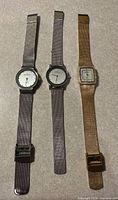 Full view of three Skagen wrist watches laid flat