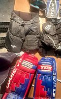 Top view of Vaughn chest protector, Itech glove, TPS leg pads