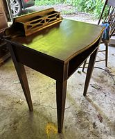 small dark brown writing desk with gallery back