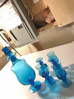 decanter and six goblets on table