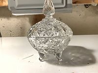Covered cut crystal candy dish on three feet
