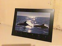 Front view of framed whale seascape print showing image, TALBOT text, and black frame