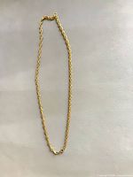 Full length view of gold-tone rope chain necklace