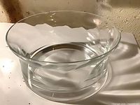 Oblique view of clear glass bowl showing flared rim and interior