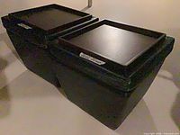 pair of ottomans angled view showing wood tops